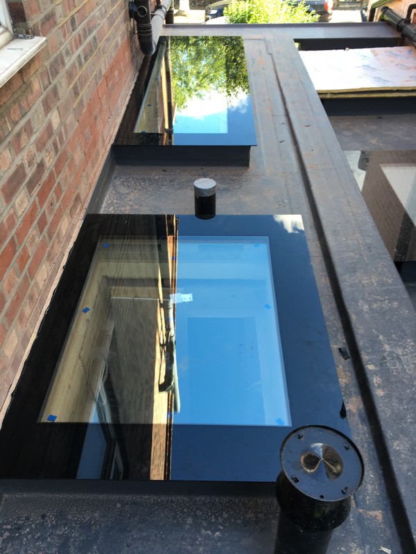 Multiple flat roof skylights on extension in Chessington